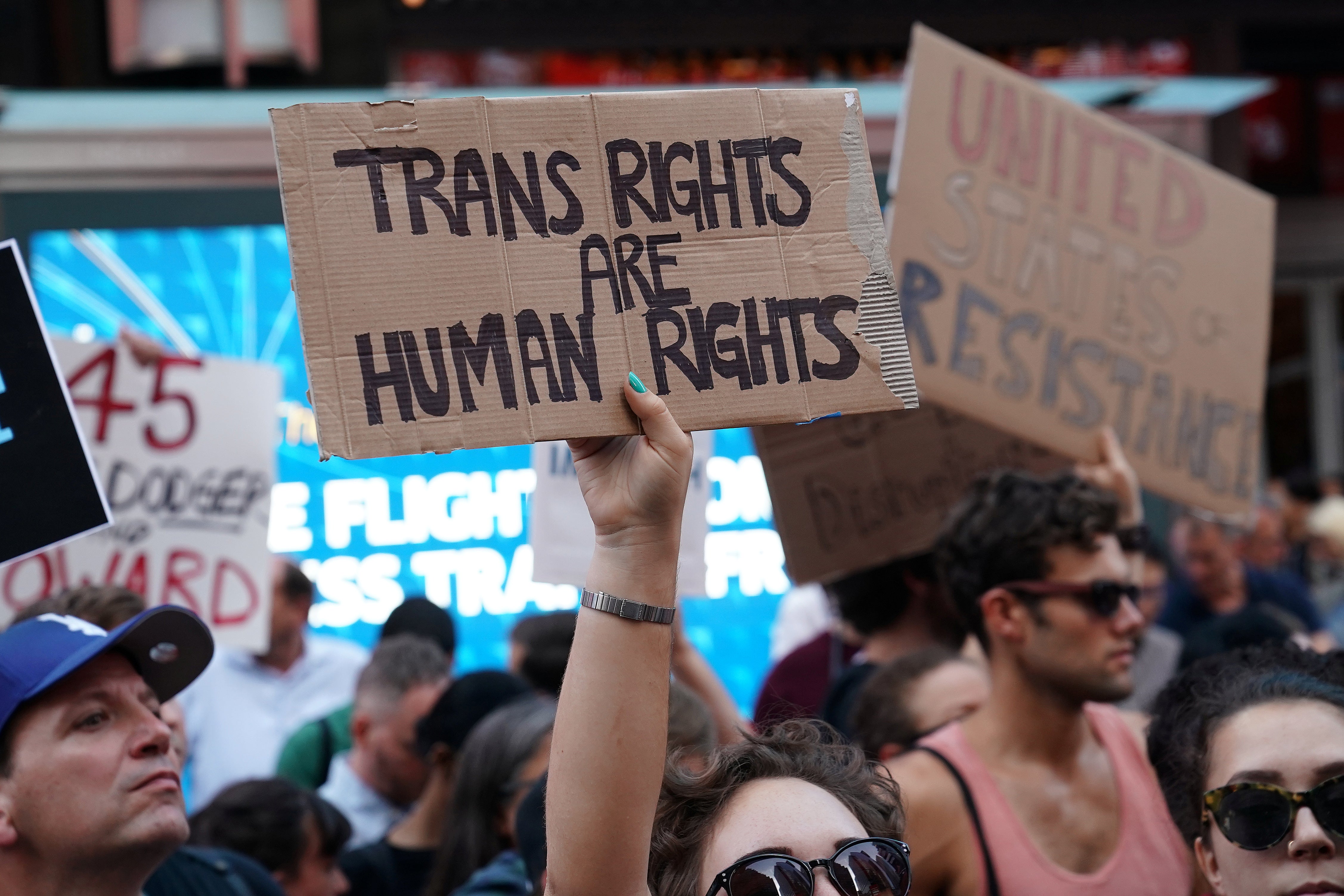 People protest President Donald Trump's announcement that he plans to reinstate a ban on transgender individuals from serving in any capacity in the U.S. military, in Times Square, New York on July 26, 2017. 