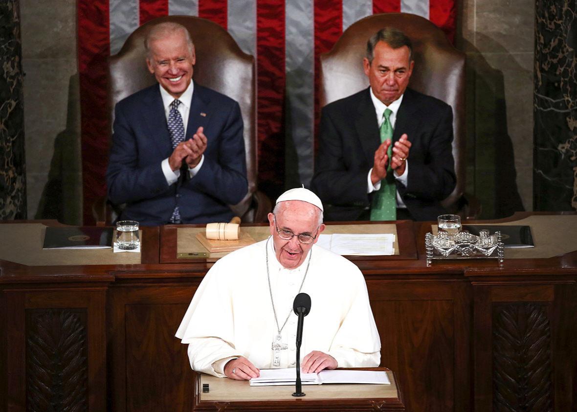 Pope Francis (C) addresses a joint meeting of the U.S. Congress with with Vice President Joe Biden (L) and Speaker of the House John Boehner.