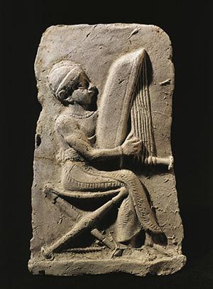 Terracotta relief depicting a harp player. Babylonian civilization, 2nd Millennium BC. Paris, Musee Du Louvre.