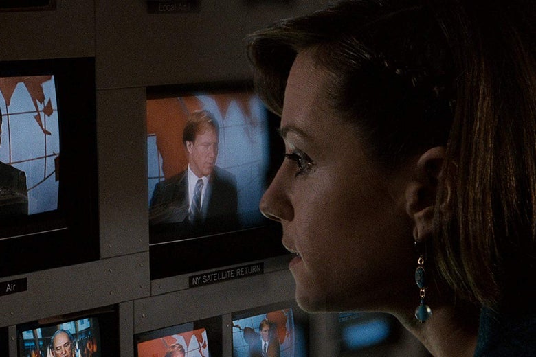 A close-up of Holly Hunter's face in a control room watching footage of anchor Willaim Hurt on several TV screens, from the movie Broadcast News.
