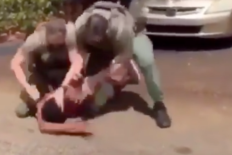 A screenshot of the video that shows the sheriff's deputies spraying pepper and hitting a teenager in Tamarac, Florida. 