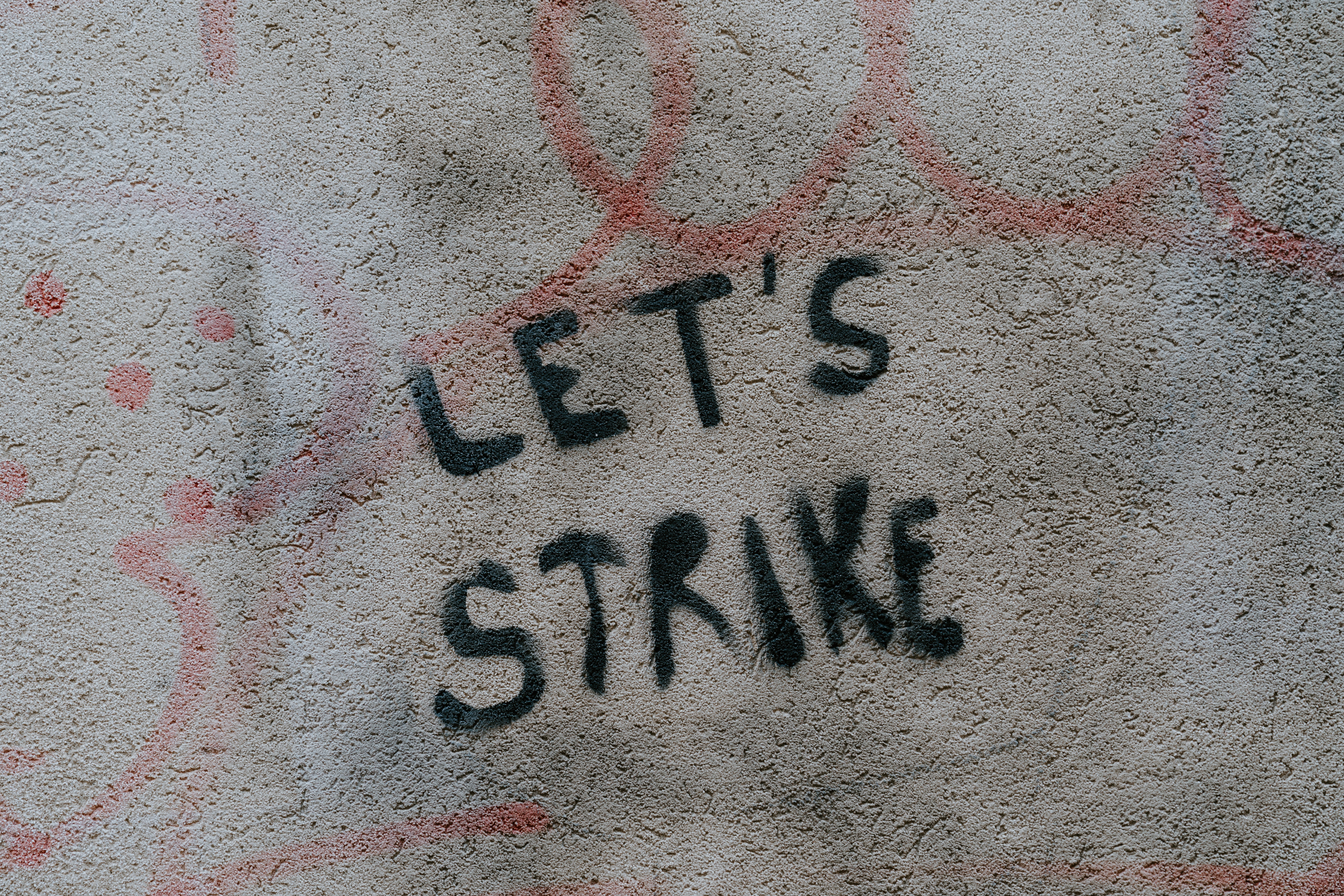 Graffiti says "Let's strike."
