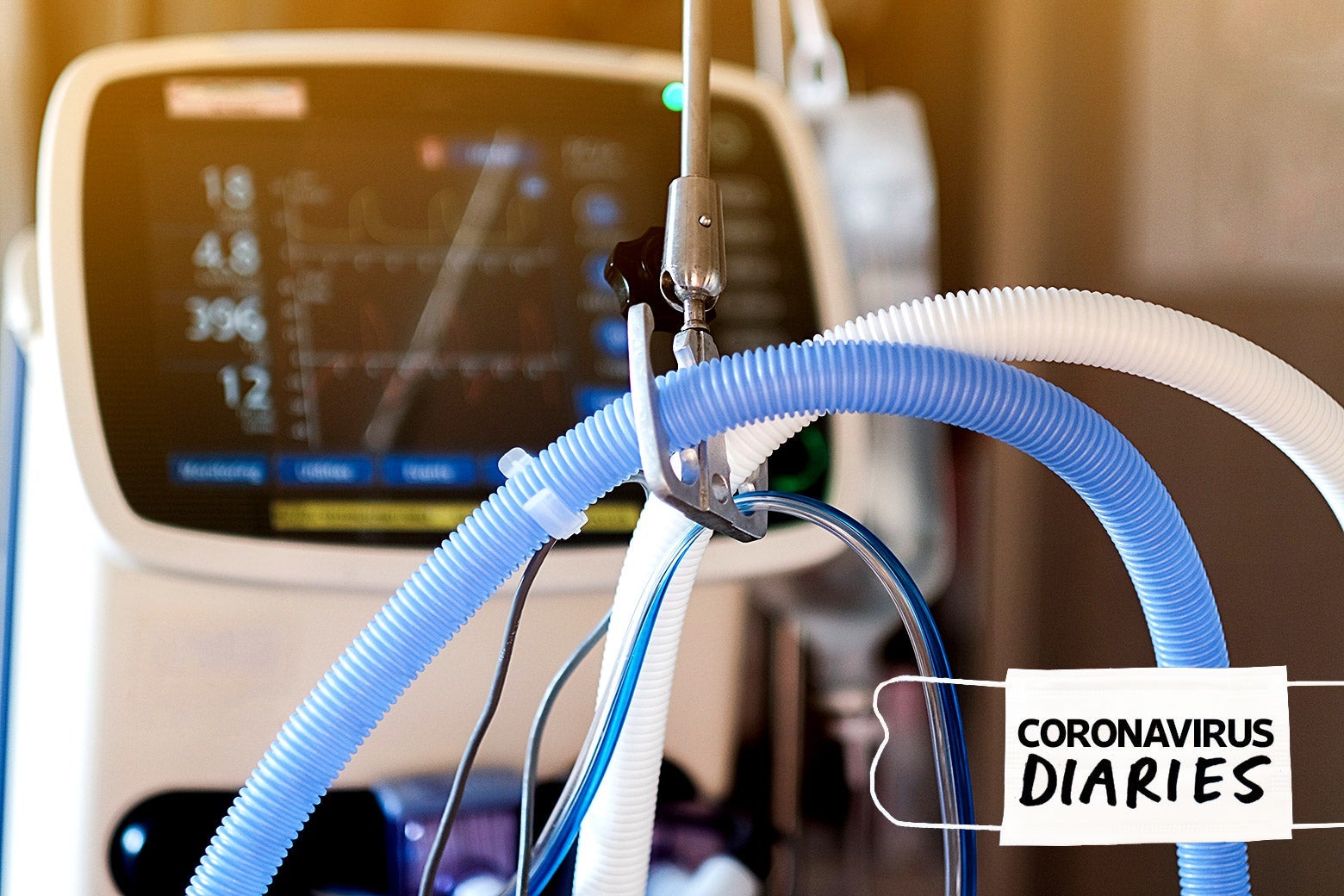 Ventilator tubes in front of a monitor.