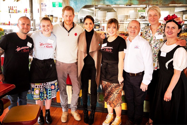 The royal couple with the patrons and owners of Maranui Café