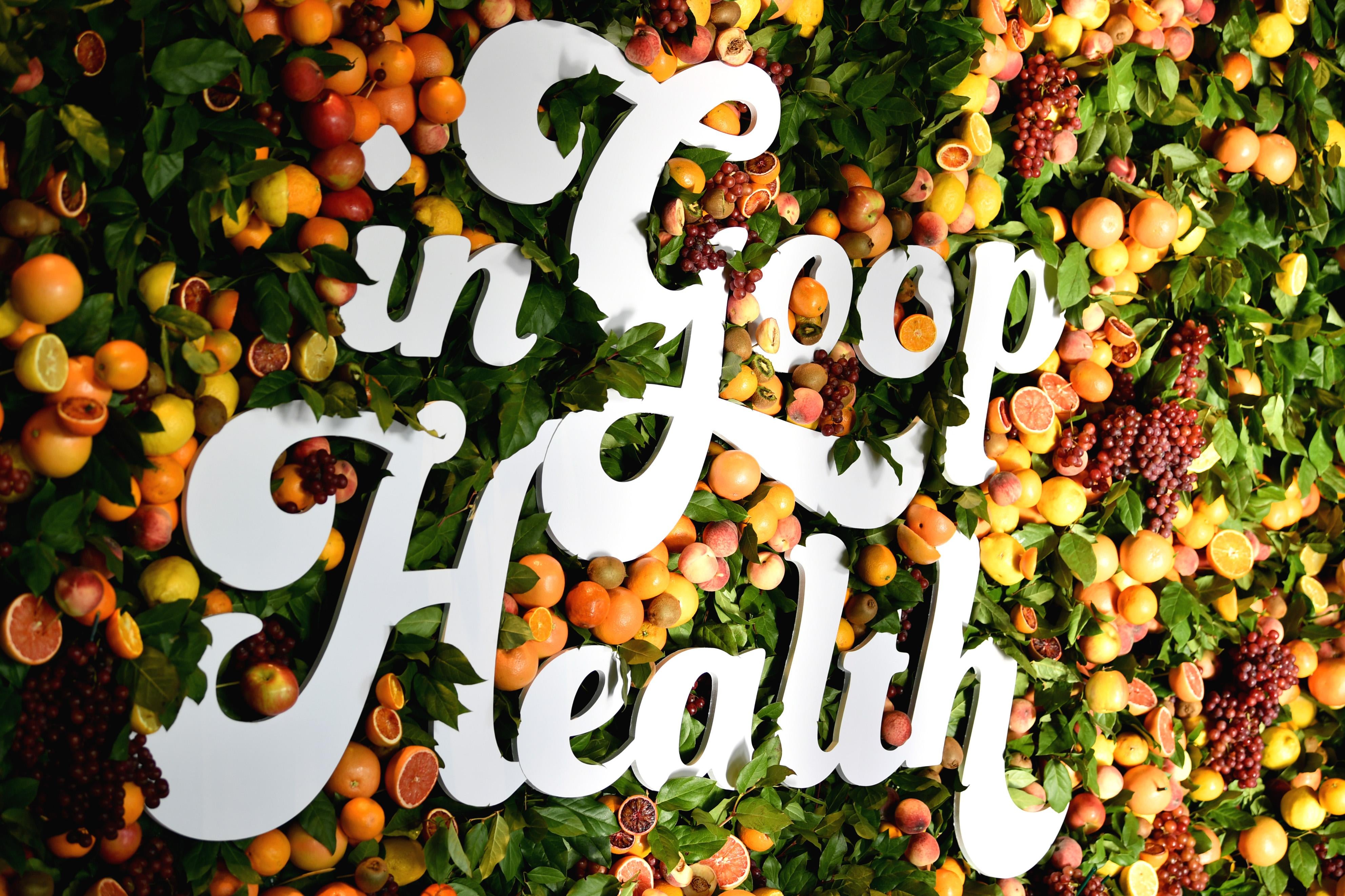 "In Goop Health" is spelled out in white letters against a floral backdrop.