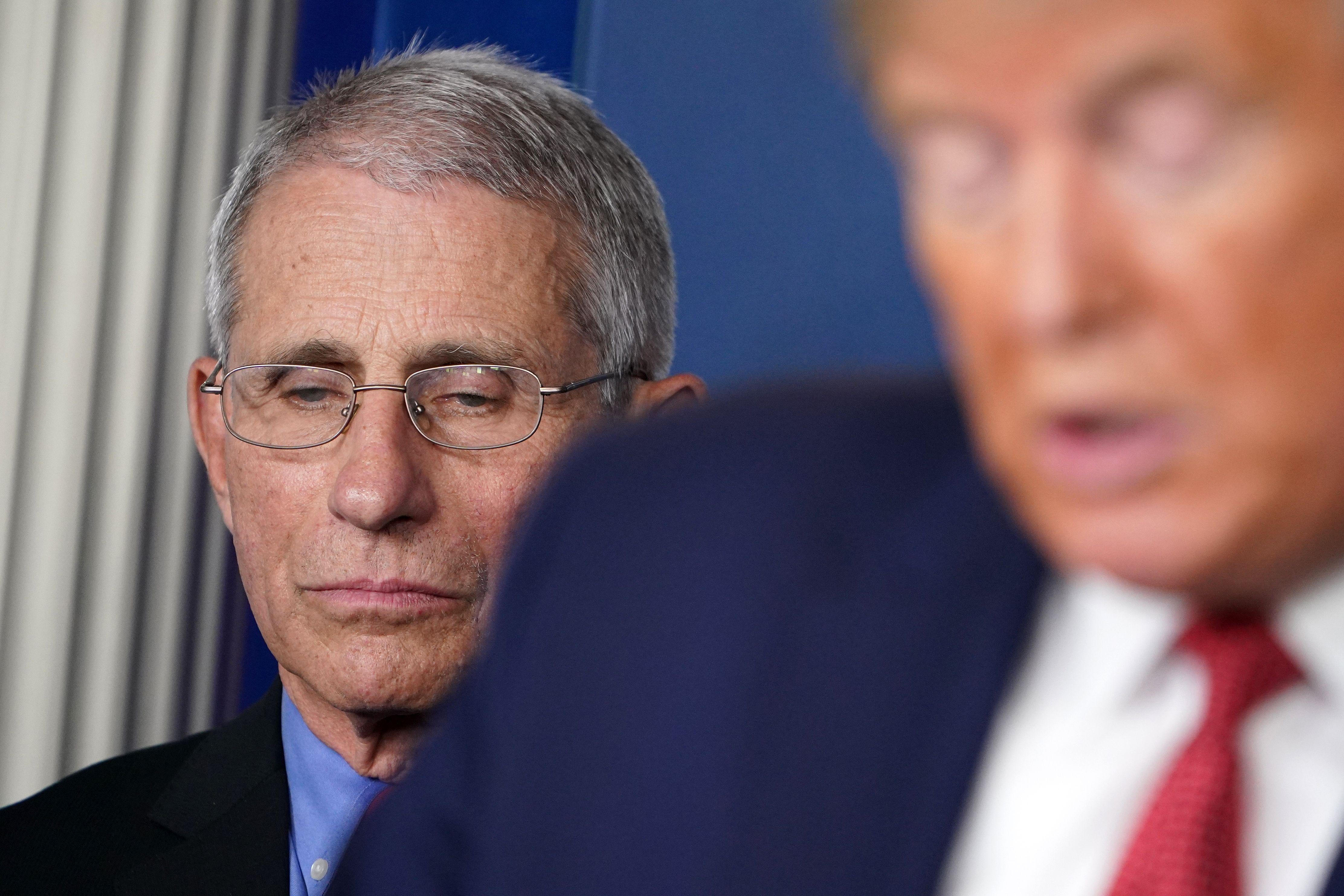 President Donald Trump, flanked by Director of the National Institute of Allergy and Infectious Diseases Anthony Fauci, speaks during the daily briefing on the novel coronavirus, COVID-19, in the Brady Briefing Room at the White House on March 25, 2020, in Washington, D.C.