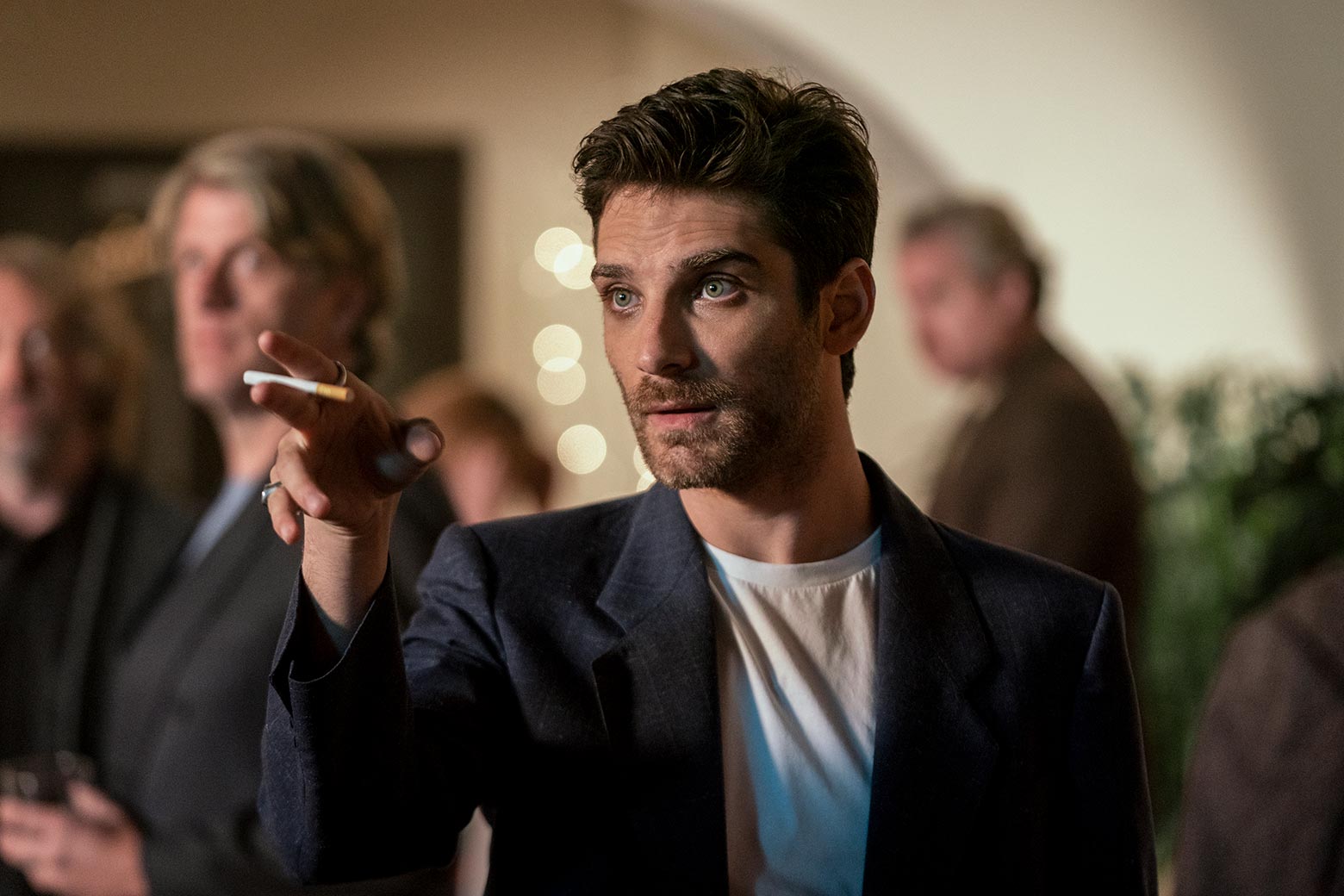 Jeff Ward gestures with a cigarette between his fingers.
