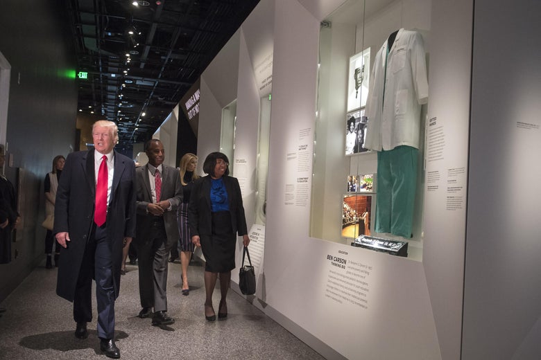 President Donald Trump, joined by Dr. Ben Carson and his wife Candy, visit the Ben Carson exhibit as they tour the Smithsonian National Museum of African American History & Culture on February 21, 2017 in Washington, D.C. 