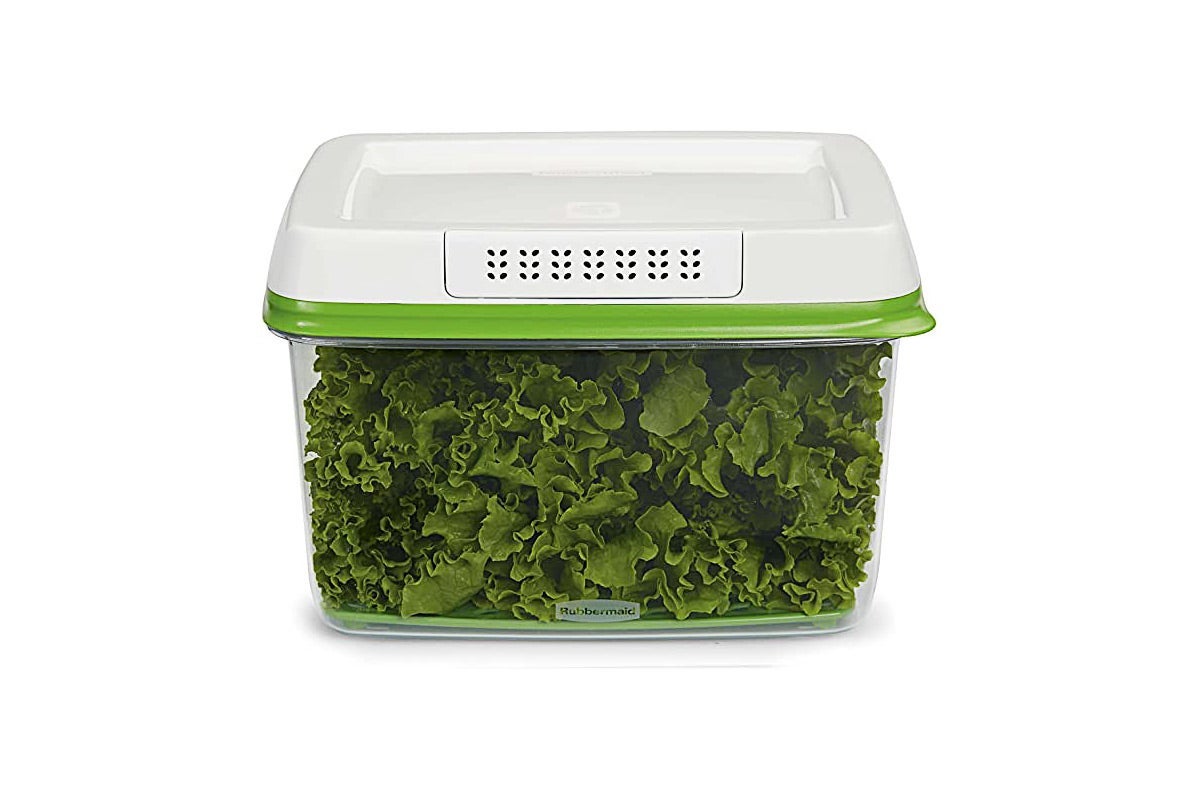 Plastic container full of greens