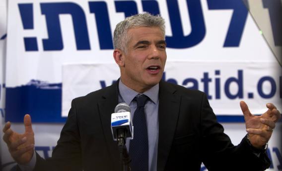 Israeli actor, journalist, and author Yair Lapid, leader of the Yesh Atid Party, speaks to supporters early on Jan. 23, 2013, at party headquarters in Tel Aviv