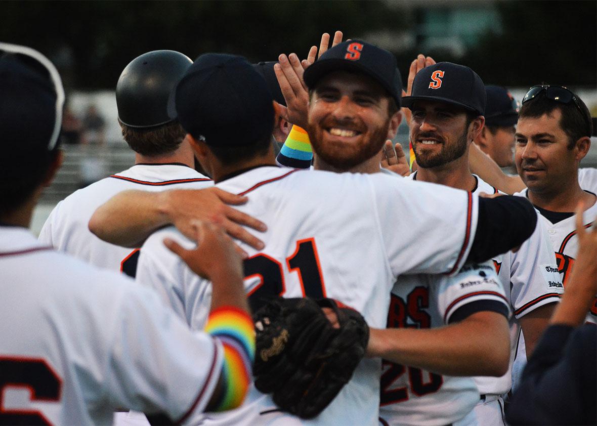 Sean Conroy celebrates with his teammates on Pride Night. 