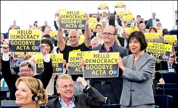 Members of the European Parliament celebrate the defeat of the Anti-Counterfeiting Trade Agreement