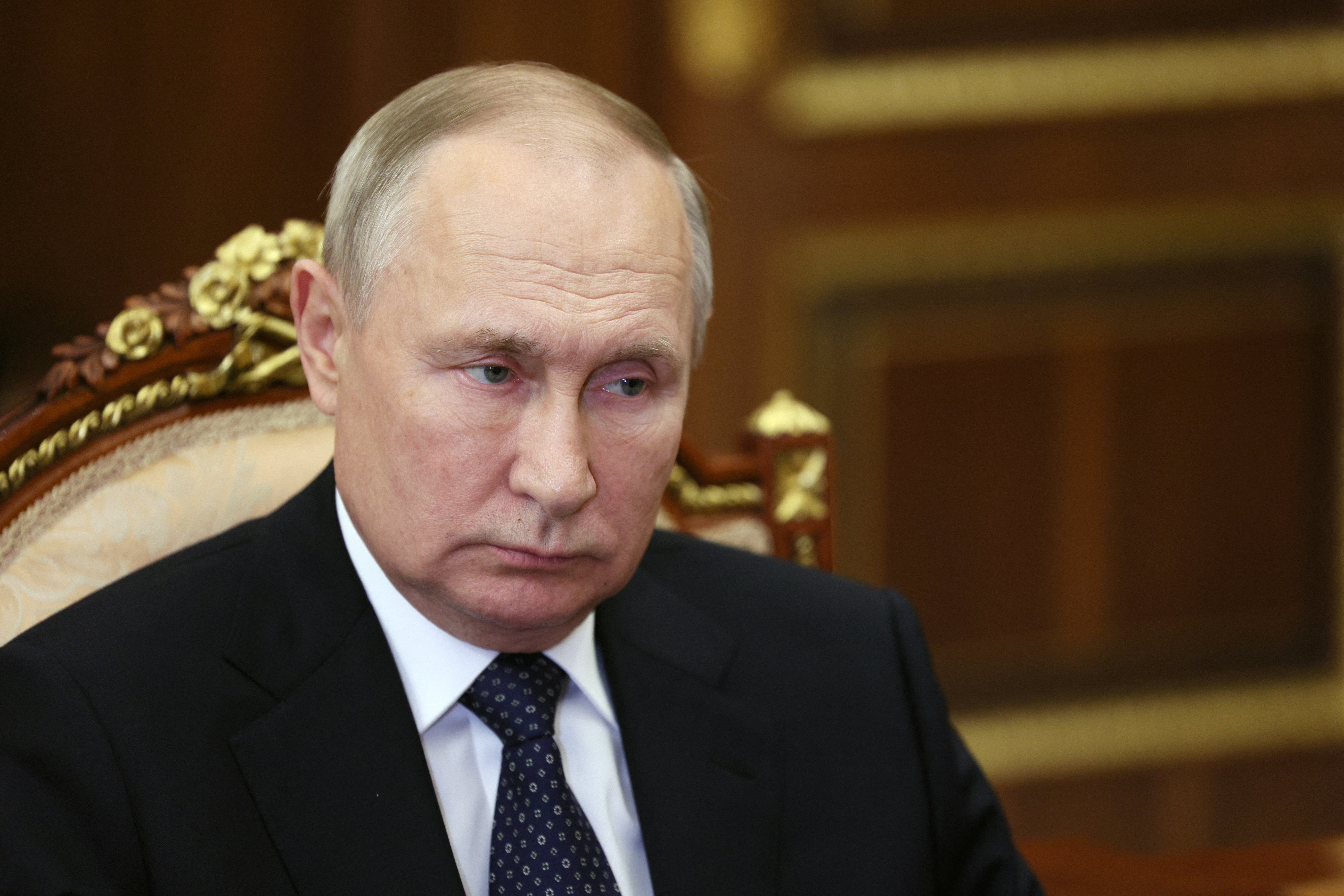 A close-up photo of Russian president Vladimir Putin, looking to the side.
