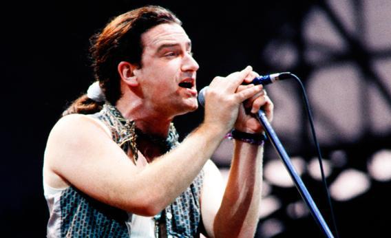 Bono performs with U2 in Paris on July 4, 1987.