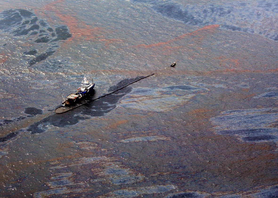 Oil floats on the surface of the Gulf of Mexico around a work boat at the site of the Deepwater Horizon oil spill in the Gulf of Mexico June 2, 2010. 