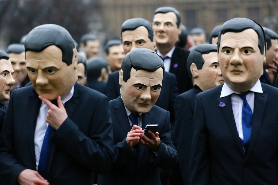 Campaigners dressed as Britain's Chancellor of the Exchequer George Osborne protest in central London on March 19, 2013. 
