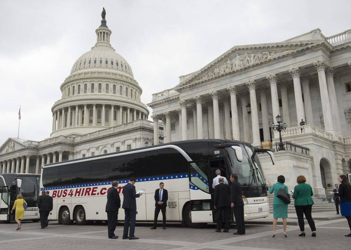 US Senators board buses at the US Capitol in Washington, DC