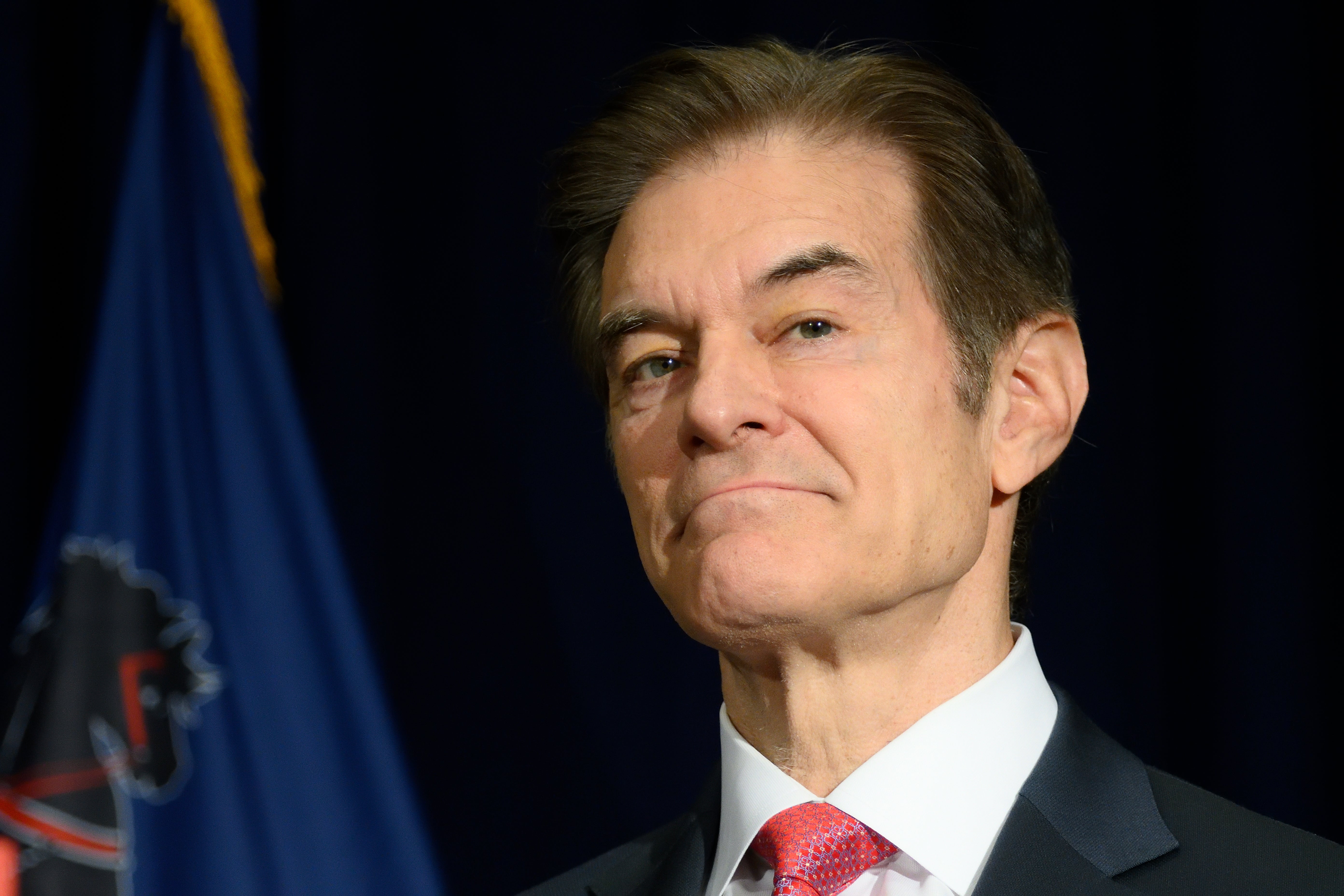 A close-up photo of Mehmet Oz, the Republican candidate in Pennsylvania running for Senate, having a press conference about how his opponent won't debate him.
