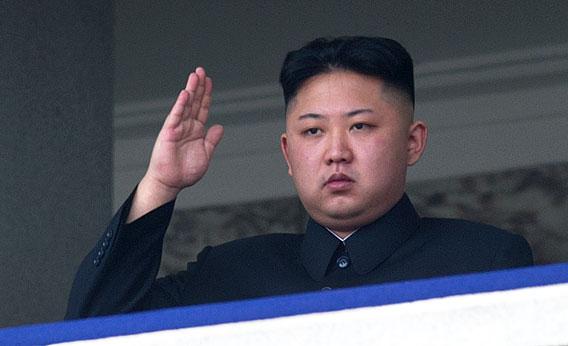 North Korean leader Kim Jong-Un salutes as he watches a military parade to mark 100 years since the birth of the country's founder and his grandfather, Kim Il-Sung, in Pyongyang on April 15, 2012. 
