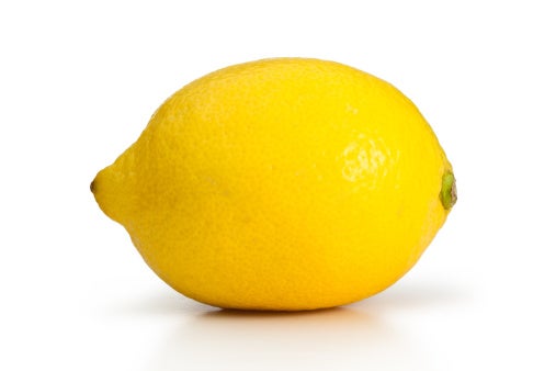 Stock art of a single lemon on a white background.