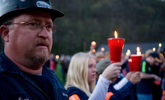 Local coal miner Kevin Honaker participate in a candle light vigil held for the deceased coal miners.