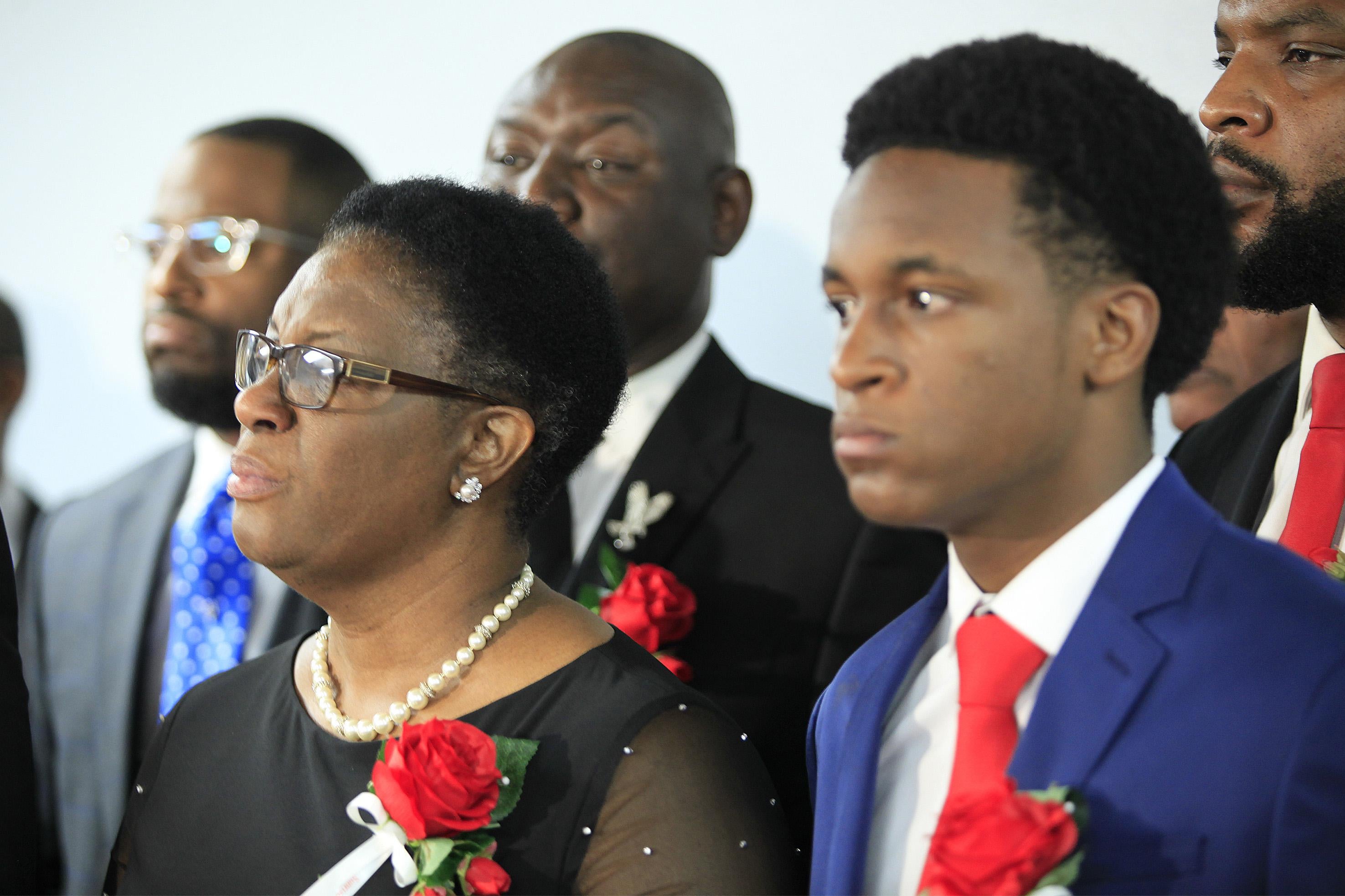 Allison Jean, mother of Botham Shem Jean, stands with family and church members of Greenville Avenue Church of Christ after the funeral service on Sept. 13, 2018, in Richardson, Texas.