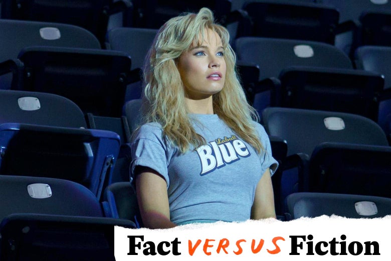 Woman with blond feathered hair in a tight Labatt Blue T-shirt sitting in the stands of a stadium