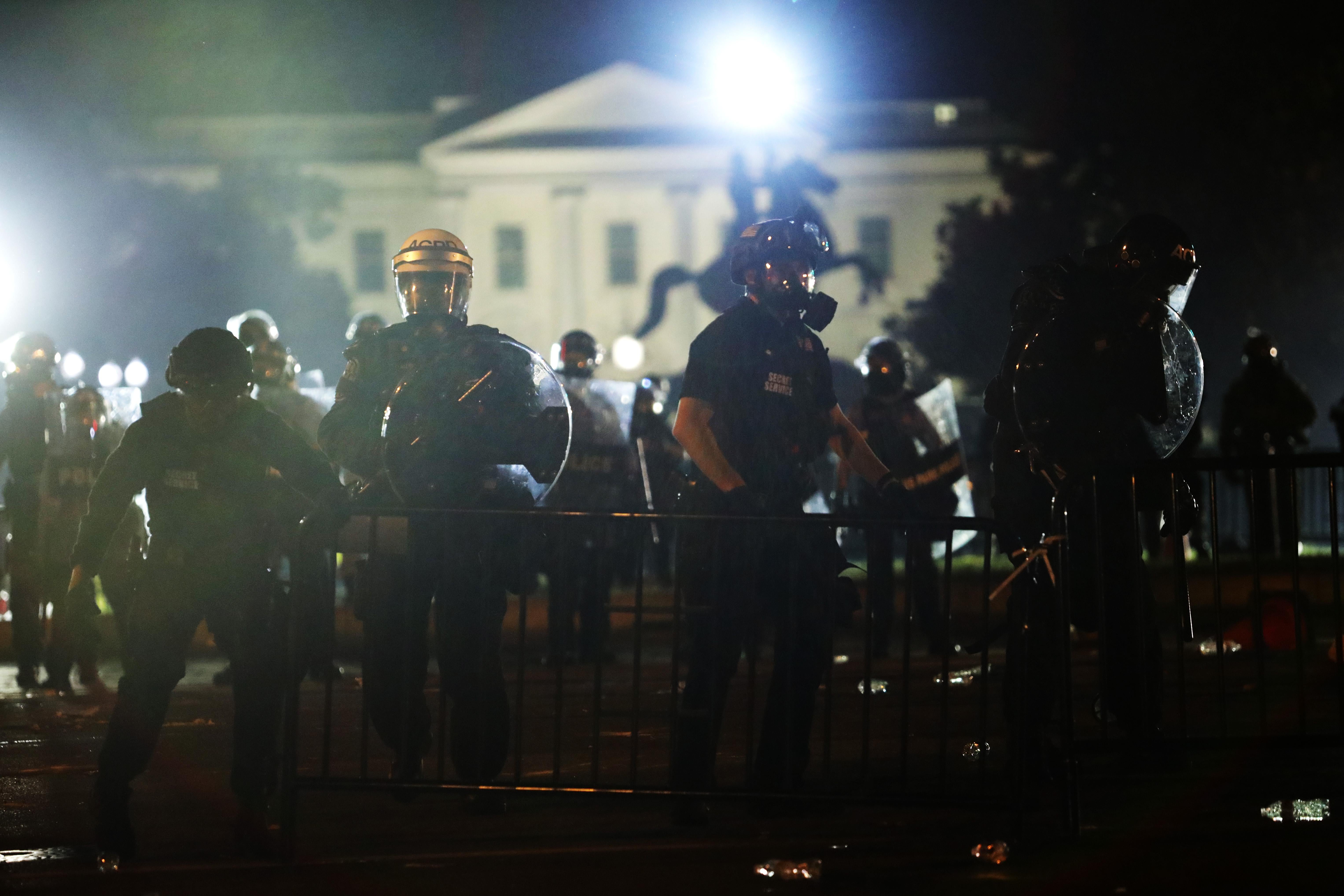 White House goes dark as D.C. protesters rage outside.