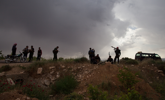 Syrian rebels take position near Qusayr, 15 kms (nine miles) from the flashpoint city of Homs, on May 10, 2012.