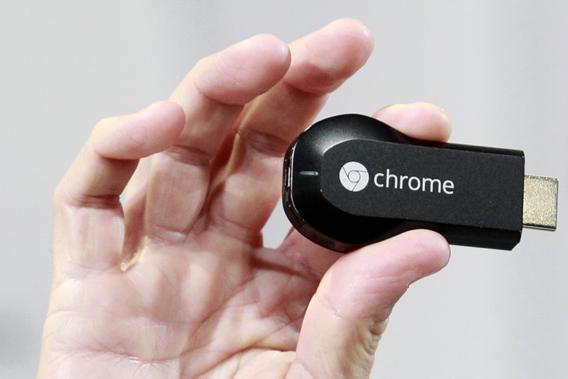 Mario Queiroz, vice president of product management, holds the new Google Chromecast dongle as it is announced during a Google event at Dogpatch Studio in San Francisco, California, July 24, 2013.