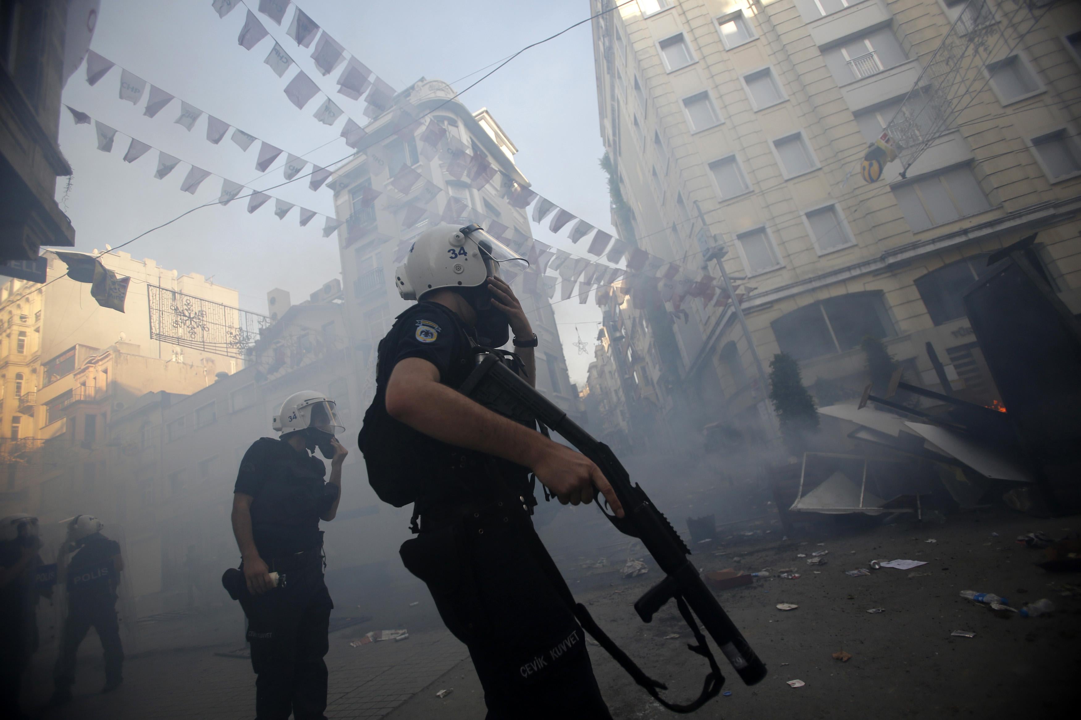 Riot police use tear gas to disperse the crowd during an anti-government protests at Taksim Square in central Istanbul May 31, 2013.