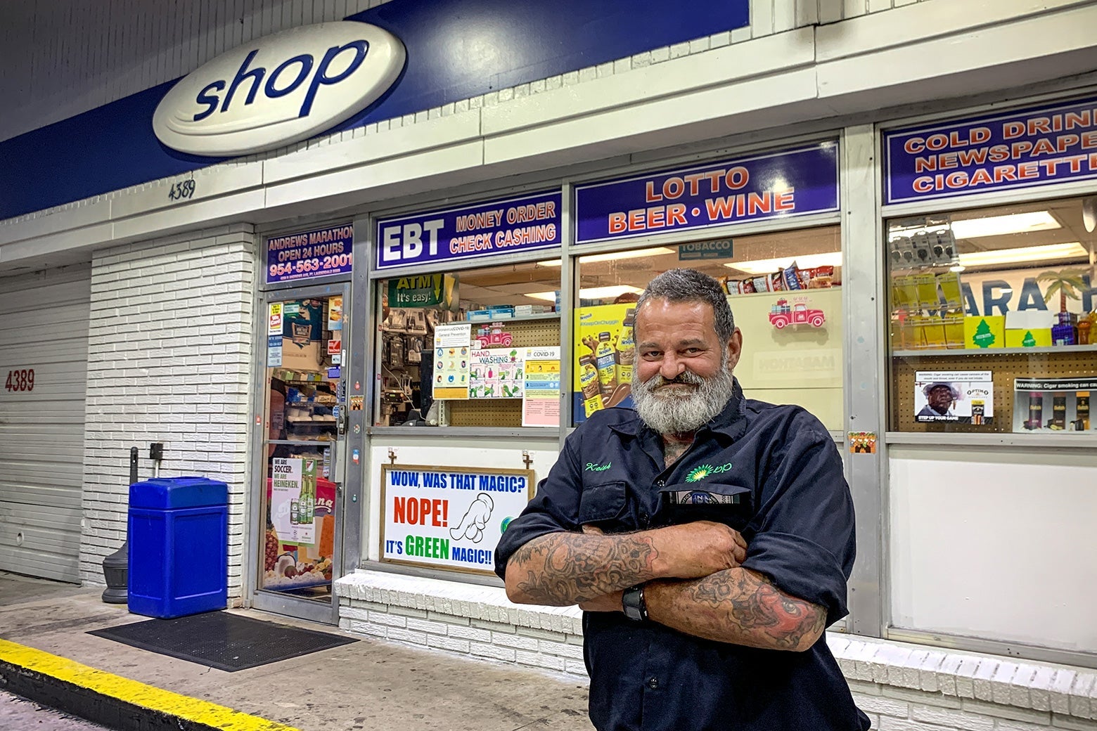 John Scammon stands in front of a gas station convenience store.