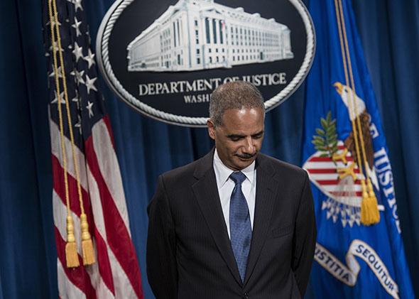 US Attorney General Eric H. Holder Jr. listens to question during a press conference at the Department of Justice .