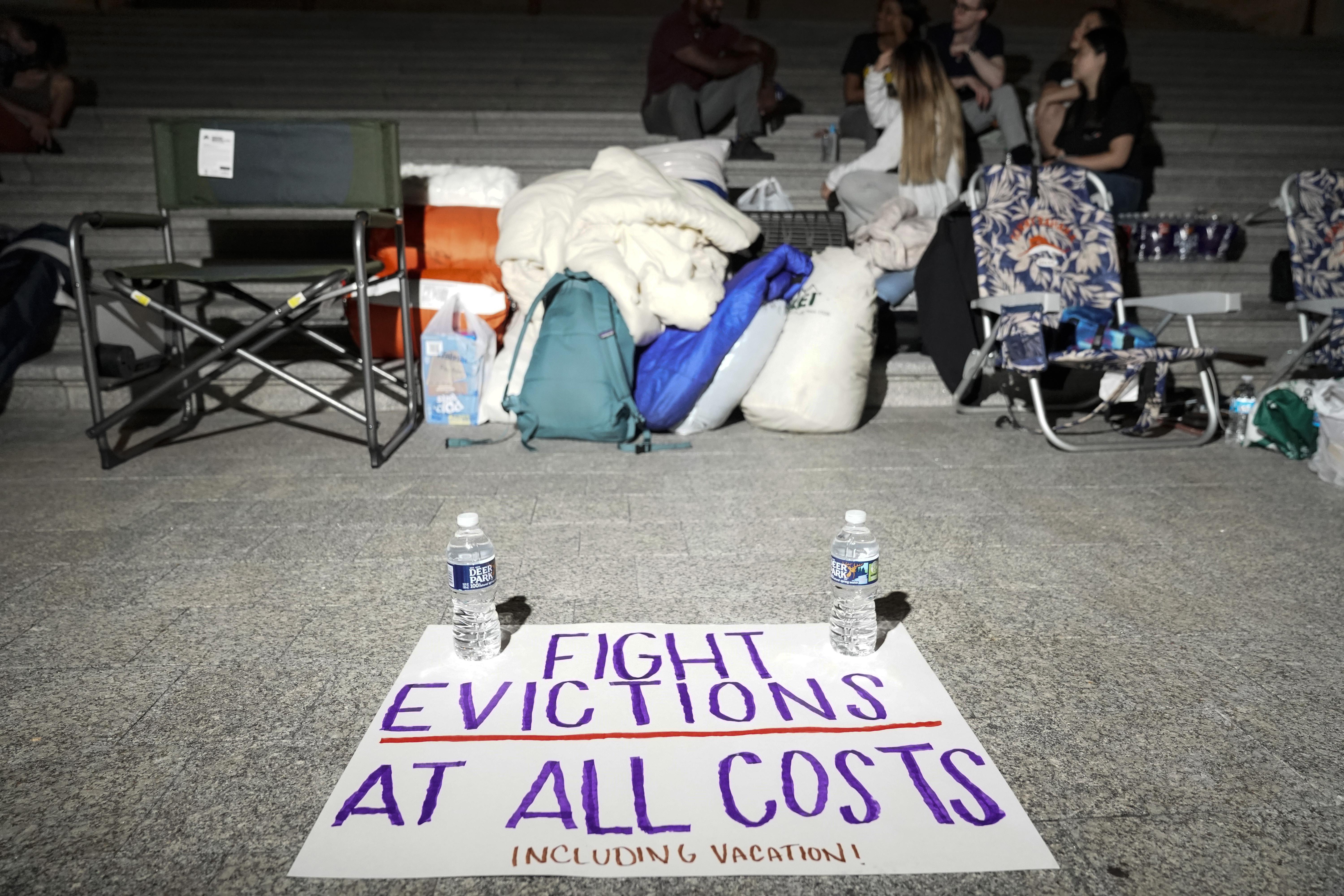 A sign calling for fighting evictions is set on the ground as Rep. Cori Bush (D-MO) spends the night outside the U.S. Capitol to call for for an extension of the federal eviction moratorium on July 31, 2021 in Washington, D.C. 