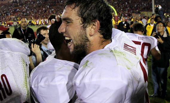 Quarterback Andrew Luck #12 of the Stanford Cardinal celebrates with teammates.