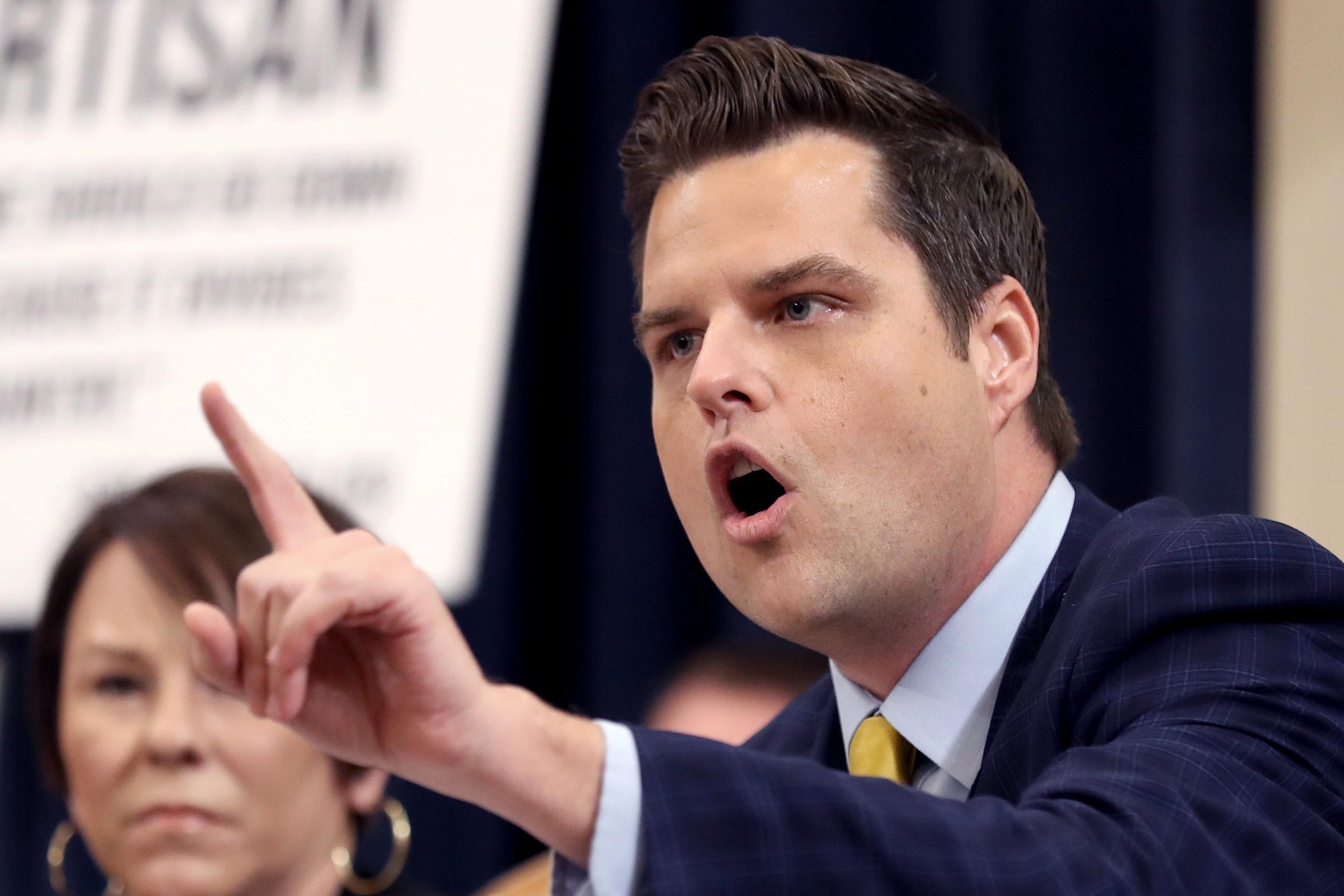 Matt Gaetz points while shouting.