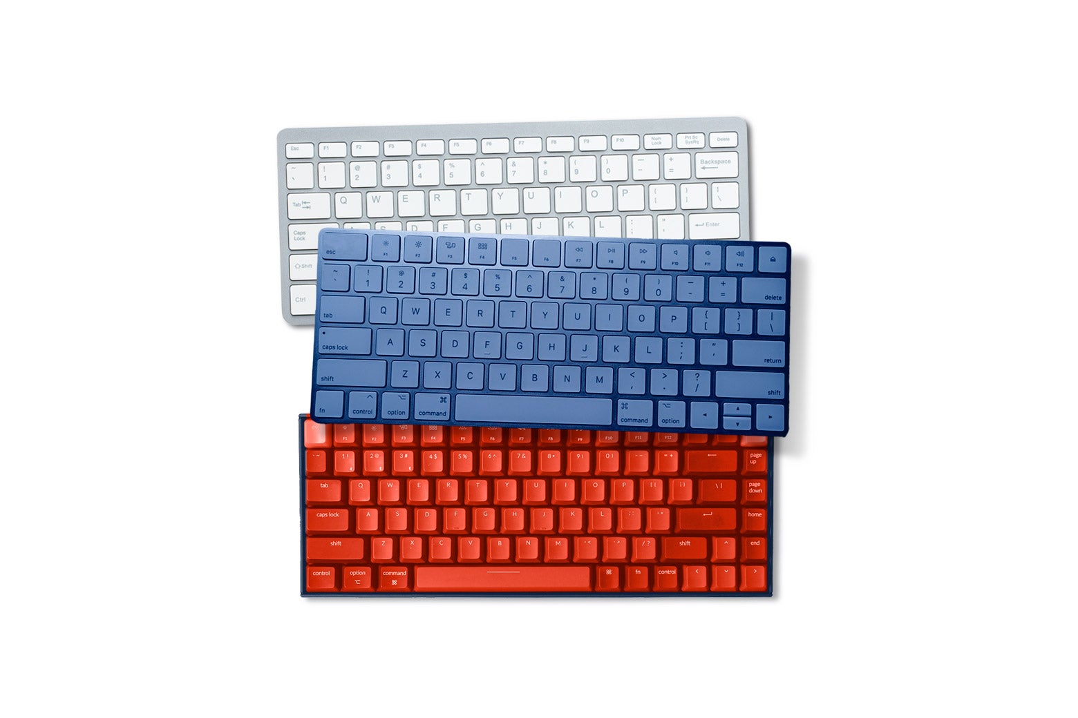 Three keyboards in different colors—white, blue, red—arranged to resemble the Russian flag.
