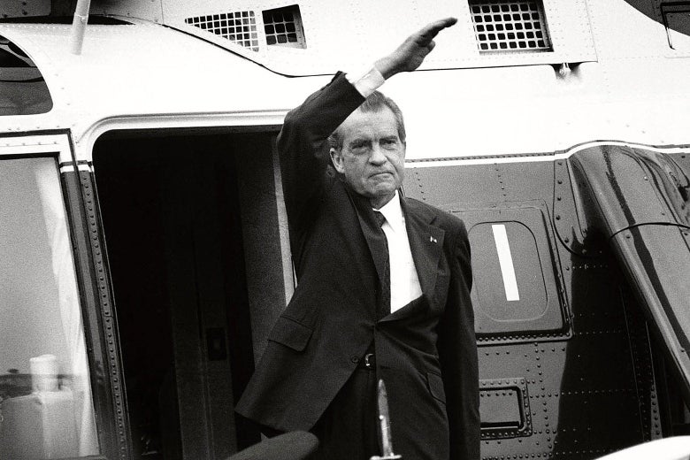 Nixon is shown in black and white waving to a crowd from the steps of the Marine One presidential helicopter.
