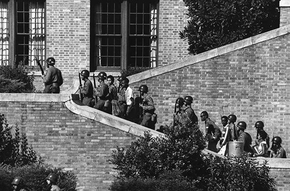 Soldiers from the 101st Airborne Division escort the Little Rock Nine students into the all-white Central High School in Little Rock, Ark., in 1957.