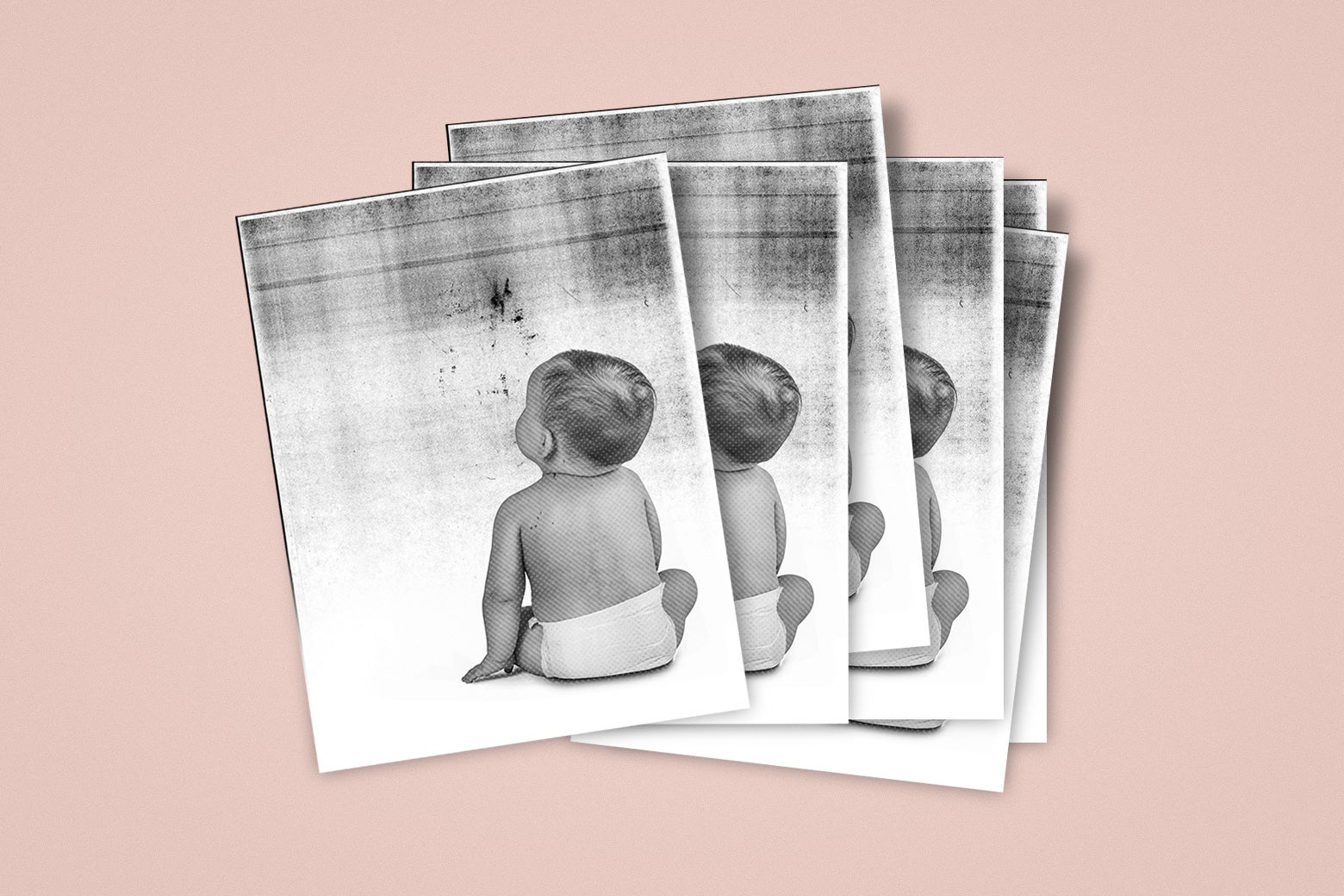 A stack of photocopied images of a baby.