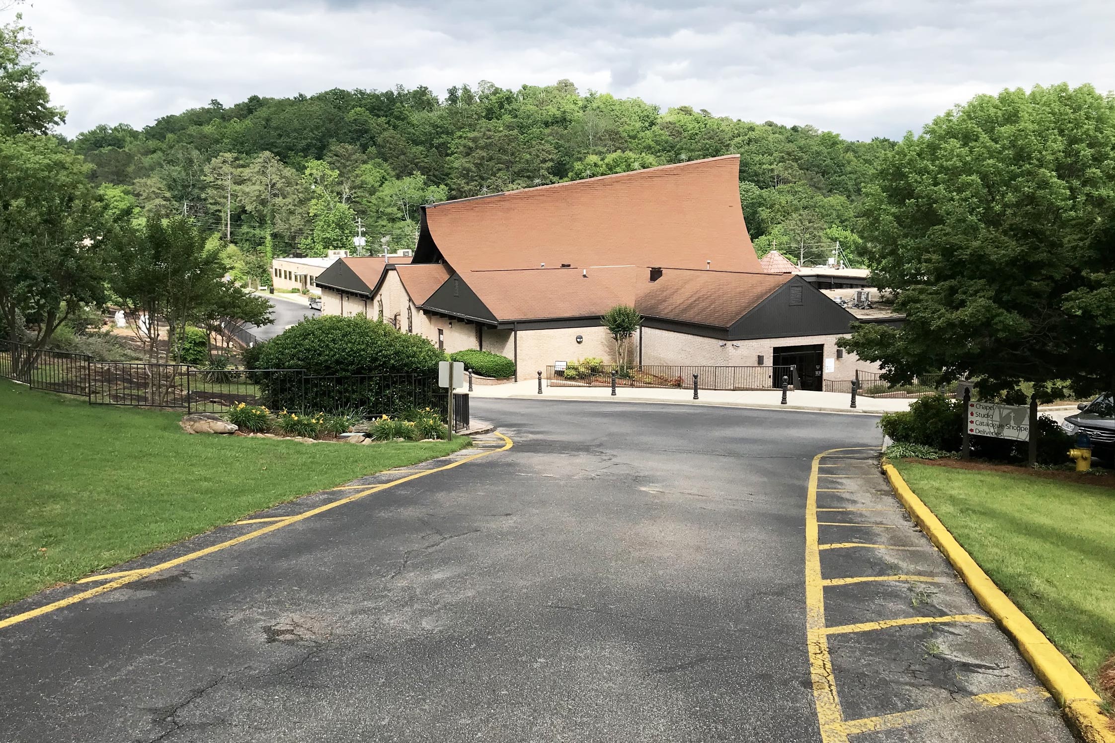 Road leading to a peaked building on EWTN's wooded campus