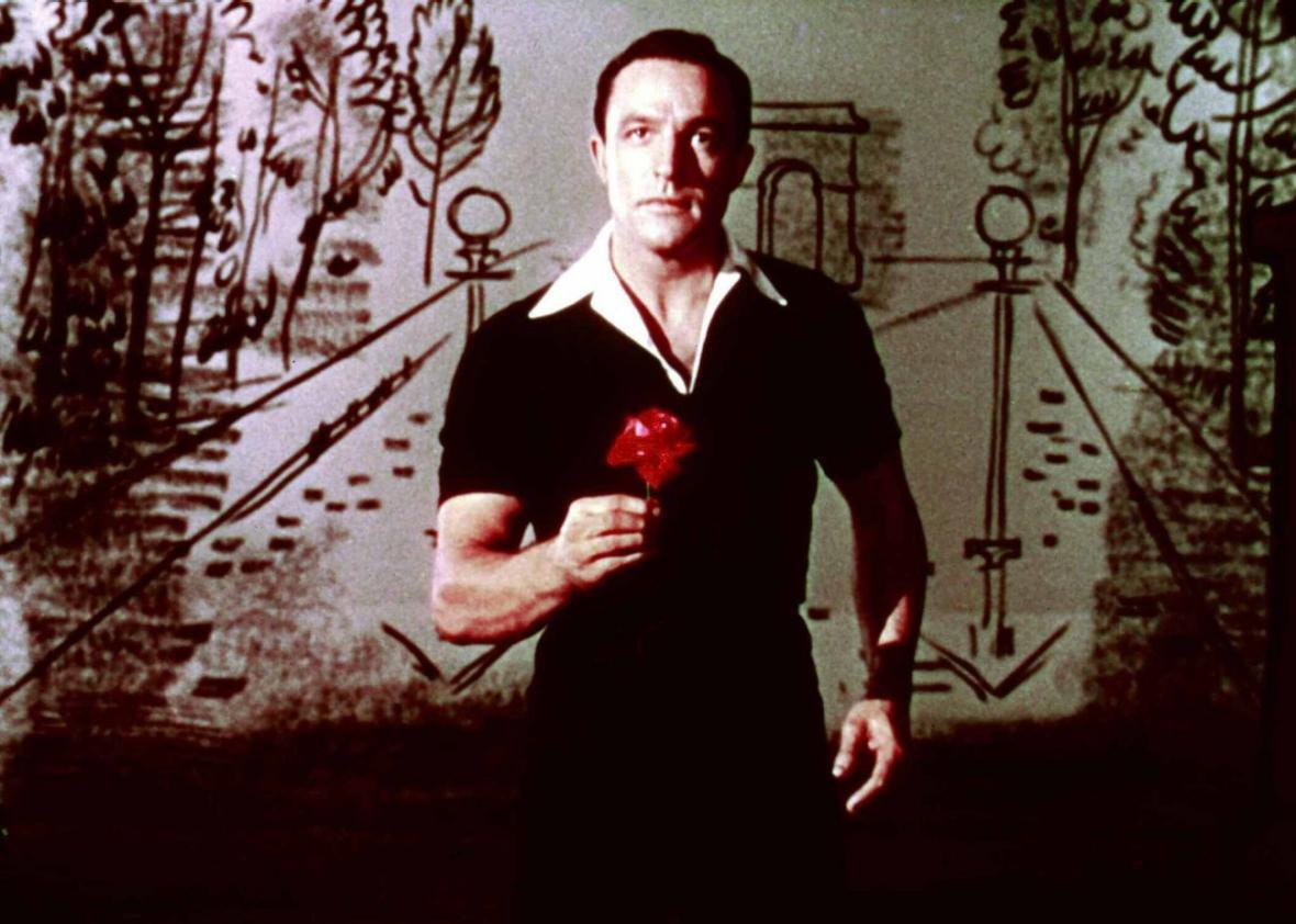 Gene Kelly, in front of a drawing of the Arc de Triomphe, in An American in Paris.