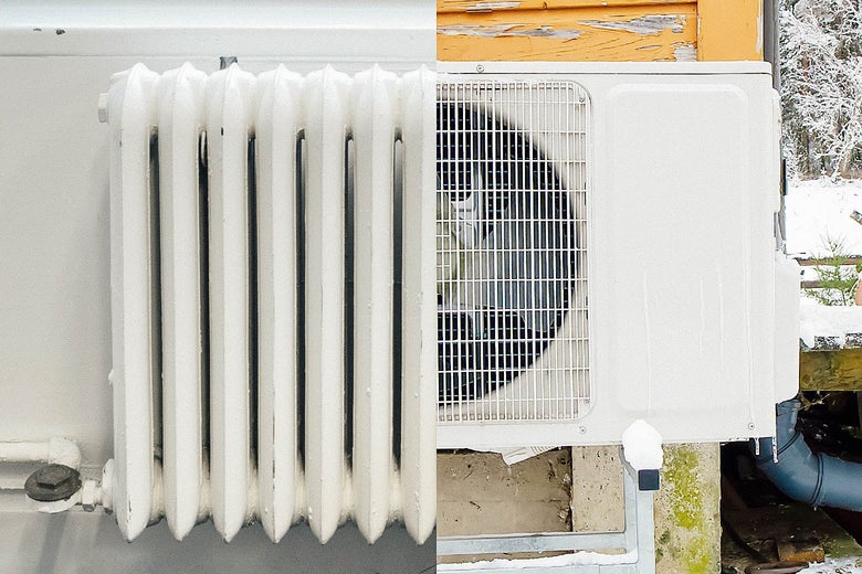 An old white water and gas heater is seen side by side with a modern heat pump.