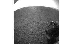One of the first images taken by NASA's Curiosity rover, which landed on Mars on the evening of August 5, 2012 PDT and transmitted to Spaceflight Operations Facility for NASA's Mars Science Laboratory Curiosity rover at Jet Propulsion Laboratory (JPL) in Pasadena, California.