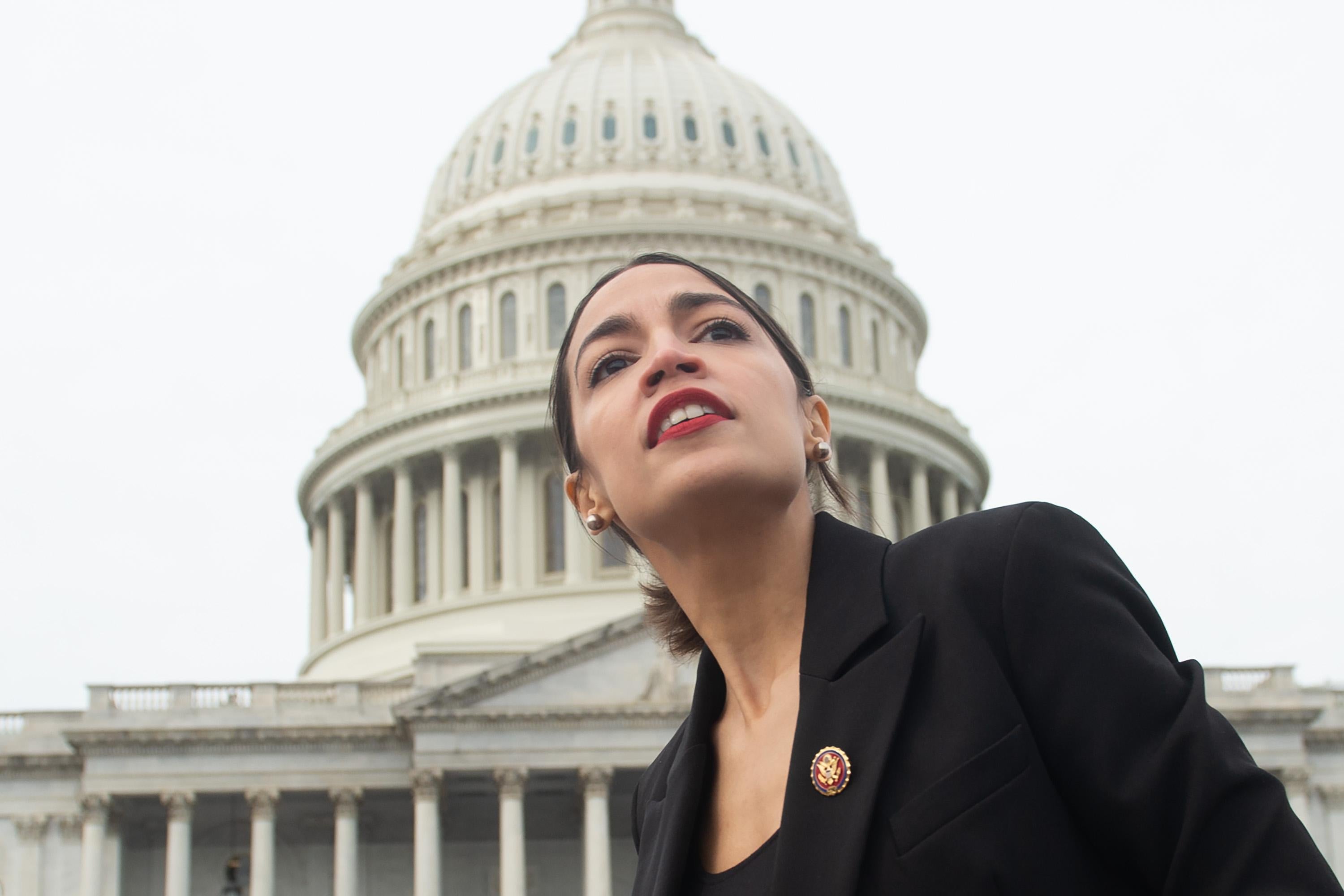 Rep. Alexandria Ocasio-Cortez, Democrat of New York, leaves a photo opportunity with the female Democratic members of the 116th US House of Representatives outside the U.S. Capitol in Washington, D.C. on January 4, 2019. 