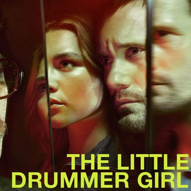 Title card for The Little Drummer Girl, featuring characters faces reflected in mirrors.
