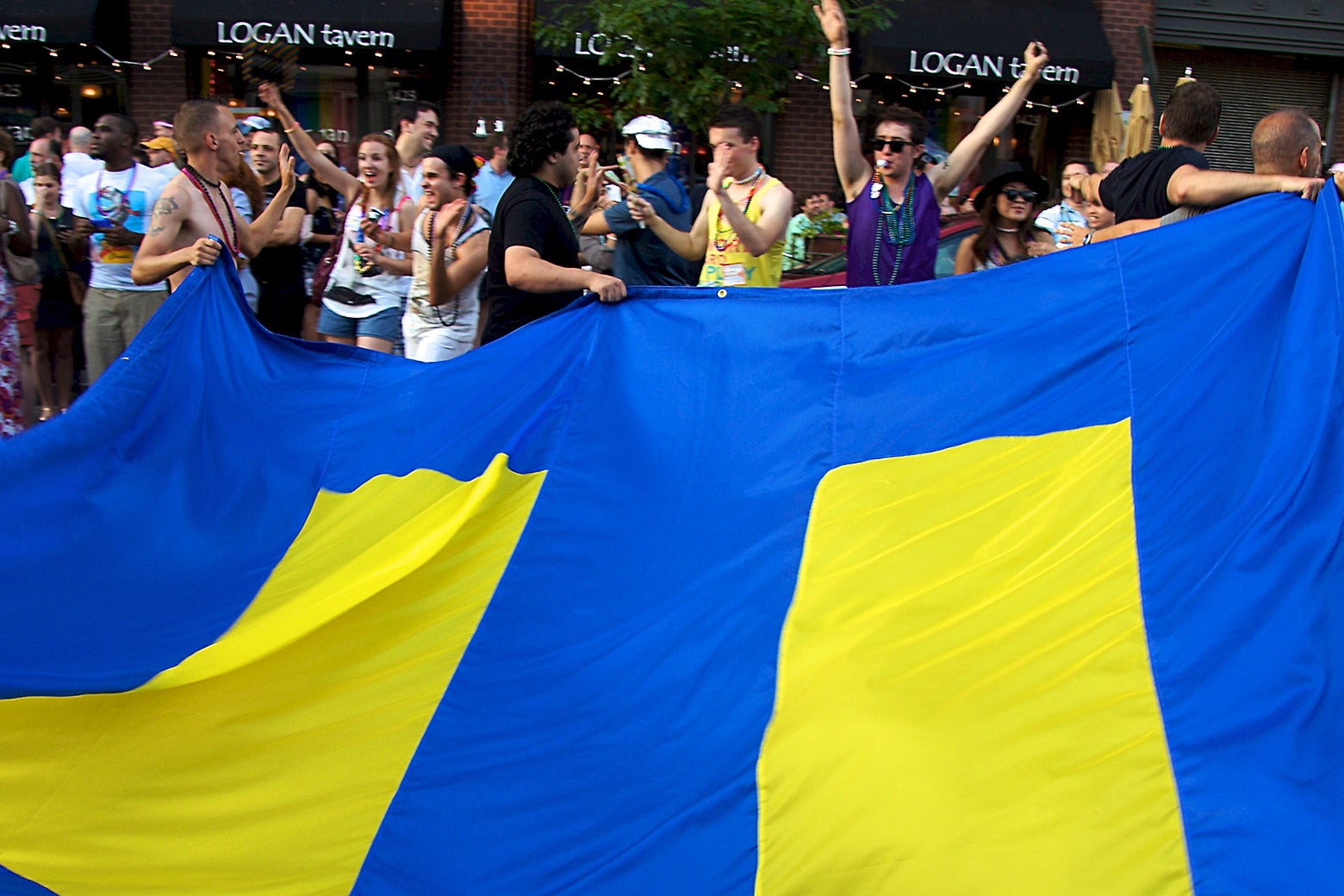 Revelers hold a Human Rights Campaign flag at the 36th Annual Capital Pride celebration in 2011.