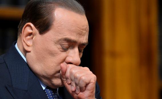 Former Italian Prime Minister Silvio Berlusconi reacts during a press conference on May 25, 2012, at the senate in Rome