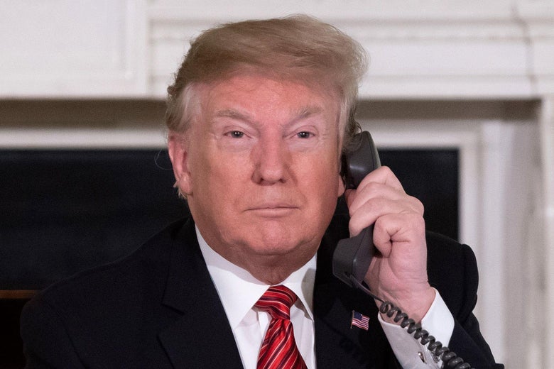 President Donald Trump speaks on the telephone in the White House on Dec. 24.