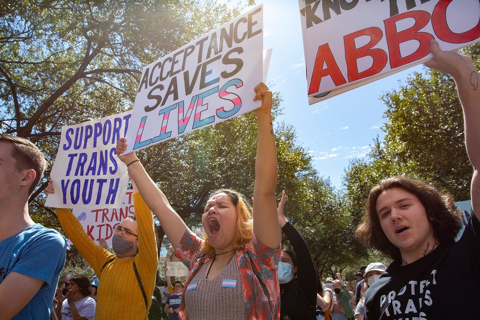 Young protesters chant their support for trans youth during a rally outside the Texas Capitol on Tuesday, March 1, 2022